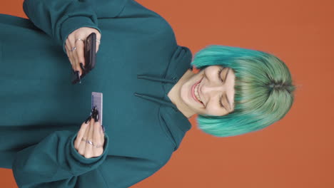 Vertical-video-of-Young-woman-shopping-with-credit-card.